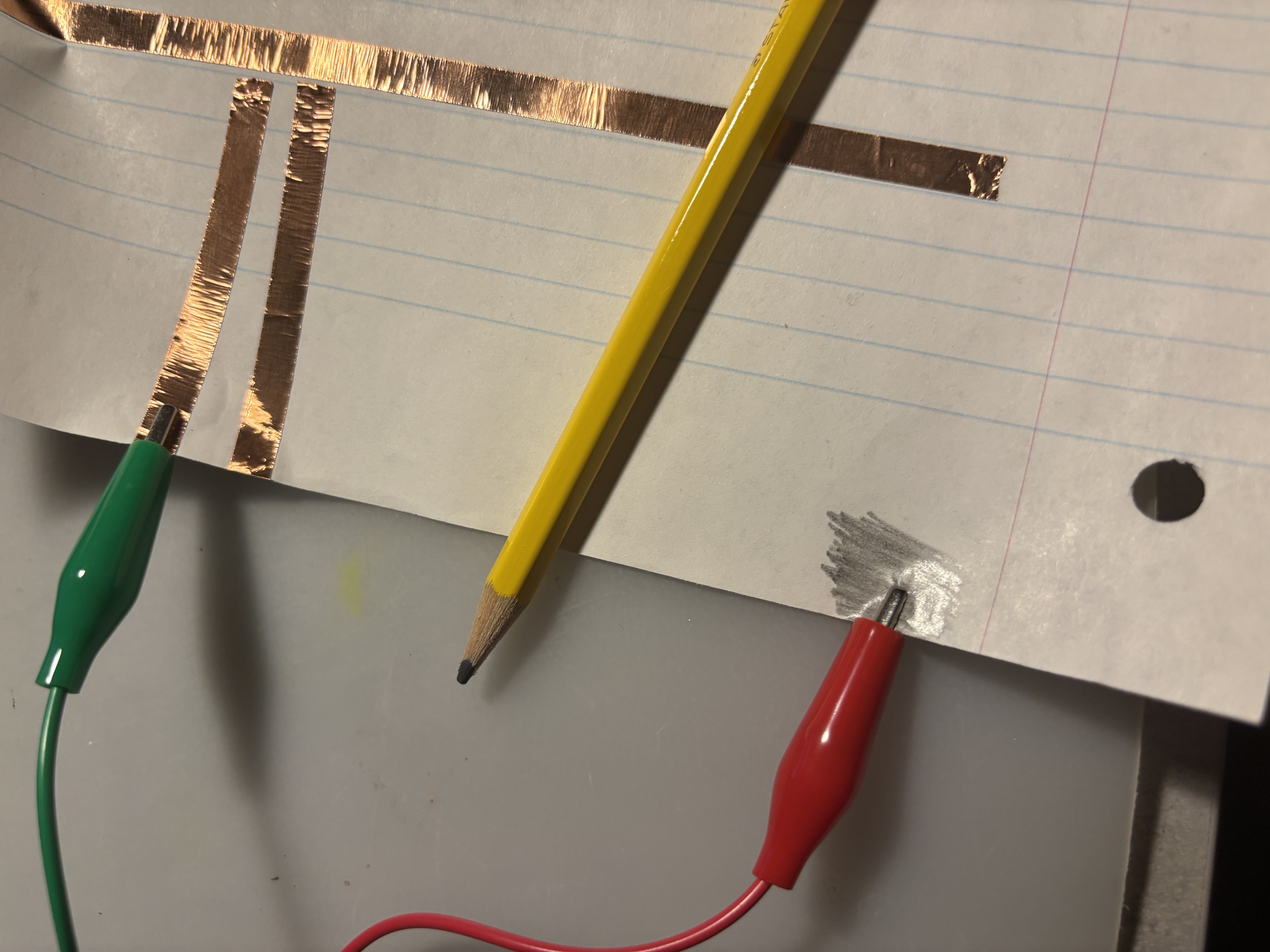 Testing the conductivity of a pencil with the Makey Makey.